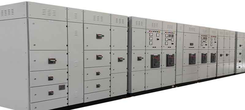Row of fully assembled electrical distribution boards and LV switchgear panels in Oman